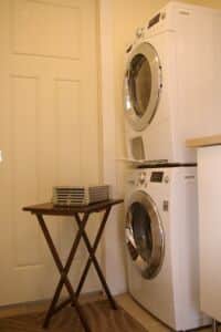 My condensing dryer has no exhaust vent but instead uses a heat exchanger to turn vapor from the clothes into water that is drained. The heat exchanger has been removed and placed on the table.