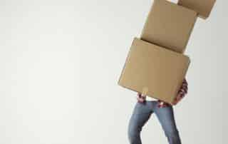 person with moving boxes